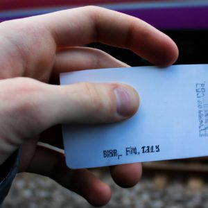Person holding a train ticket